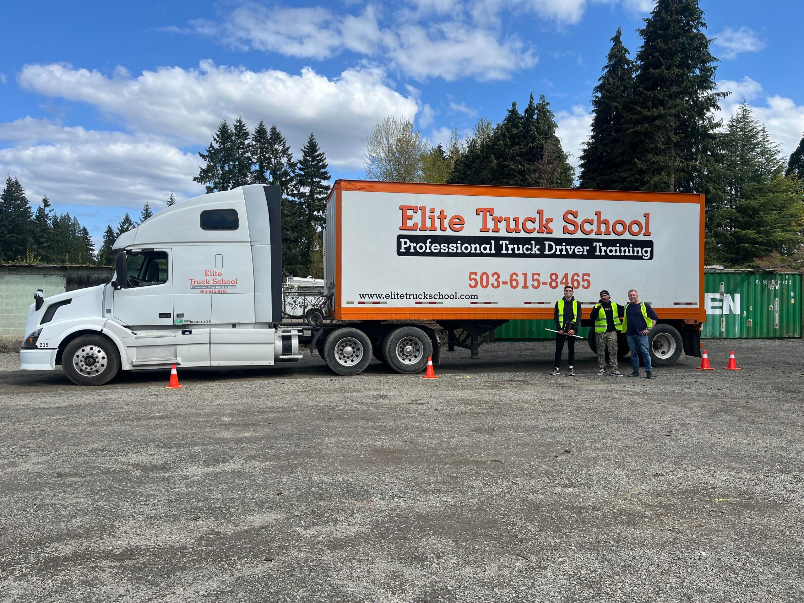 image of cdl students and instructors in the vancouver, wa training yard next to a semi-truck