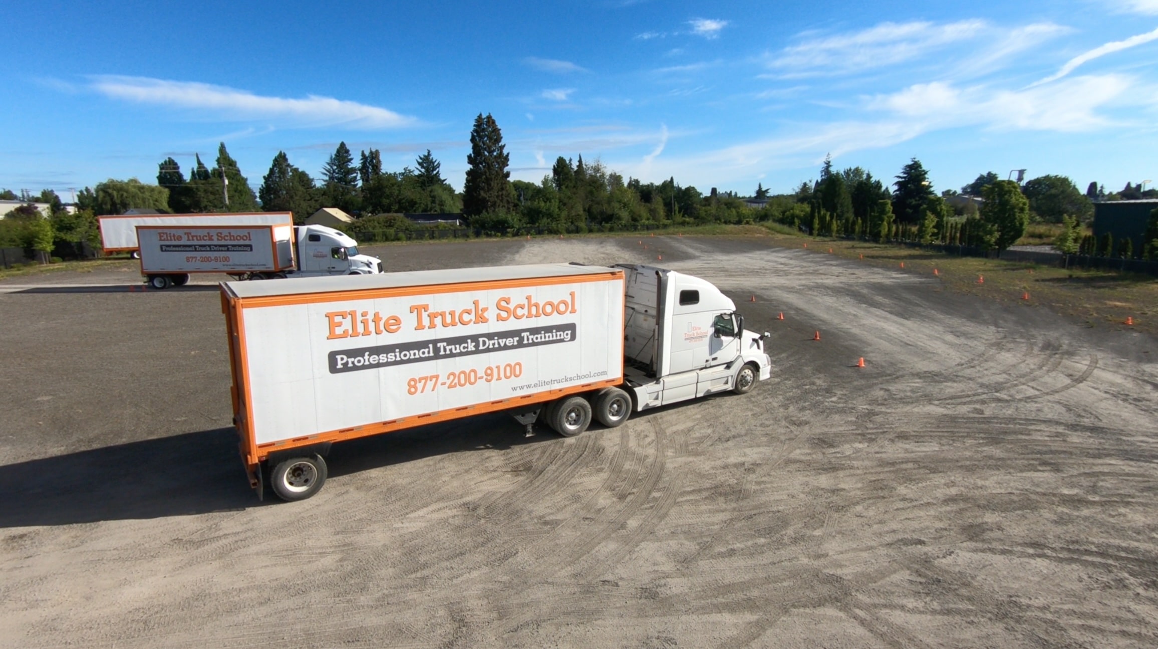 Image of an Elite Truck School semi trucking driving in training yard