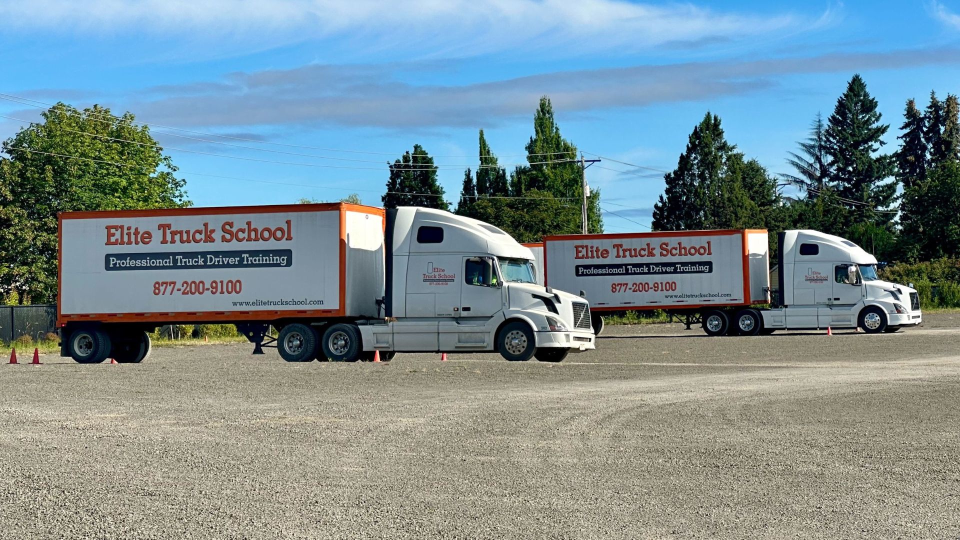 Image of two Elite Truck School semi trucks from a side view