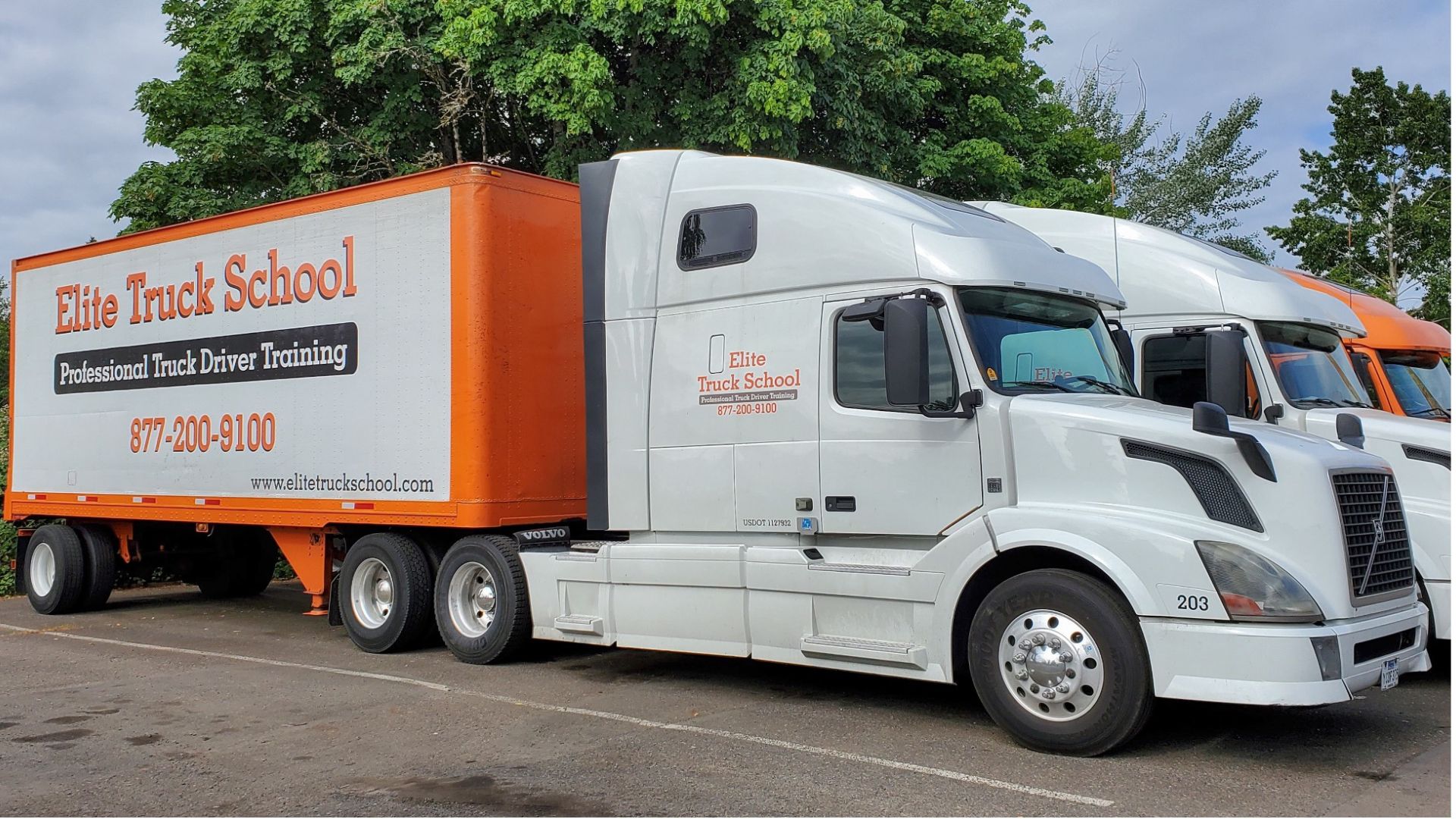 Image of three Elite Truck School semi trucks from the side view