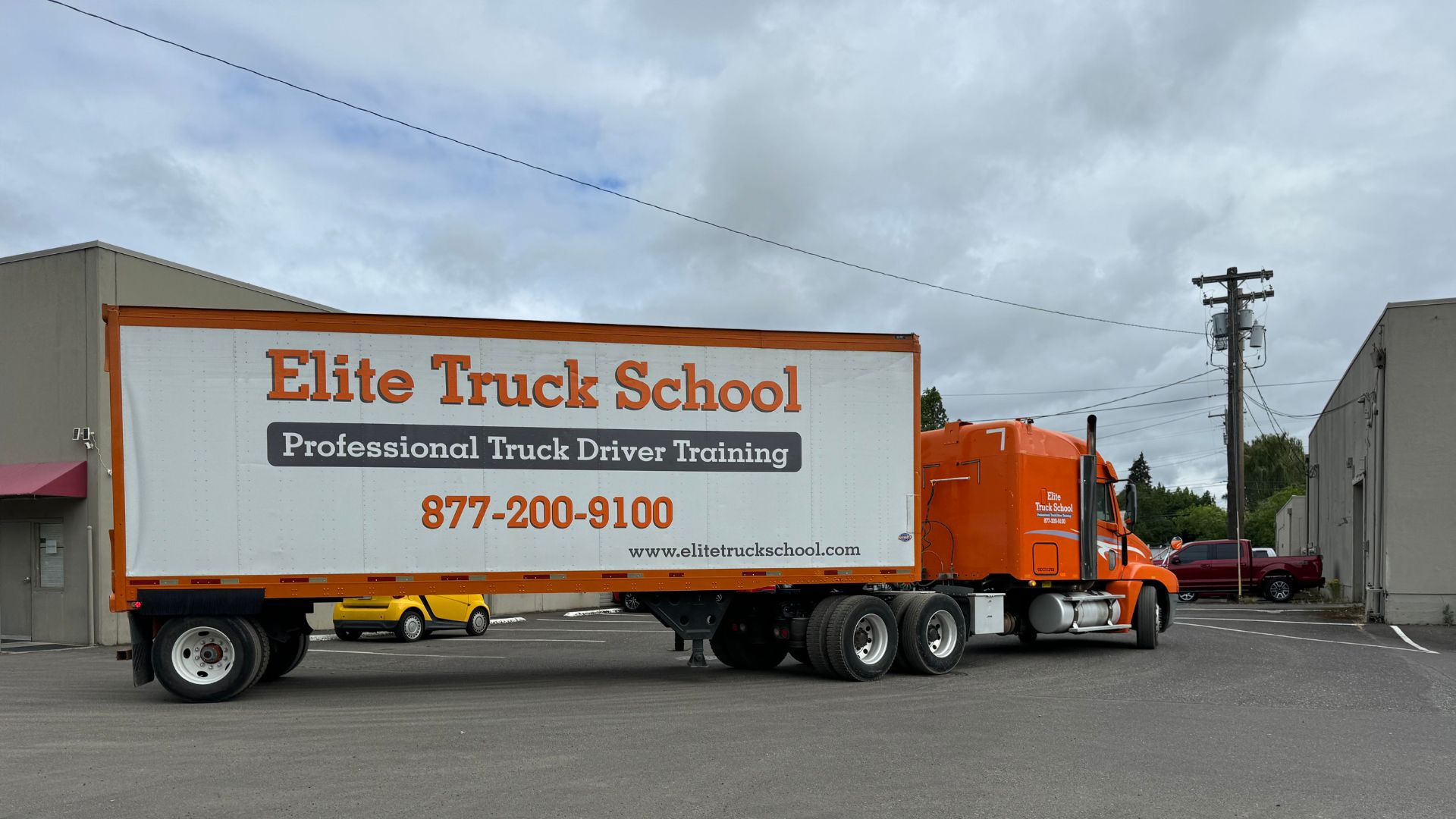 Image of an Elite Truck School semi from the back side view