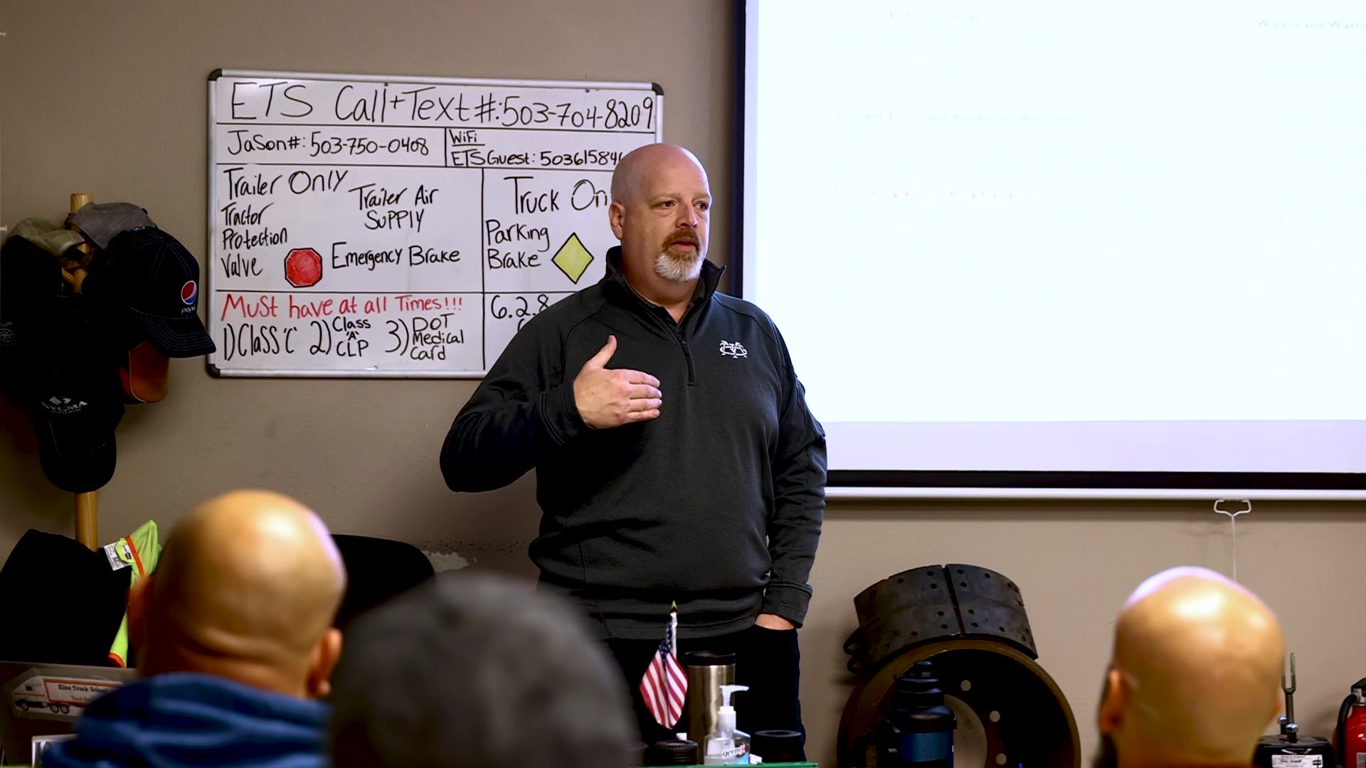 May Trucking recruiter speaking to a classroom full of students